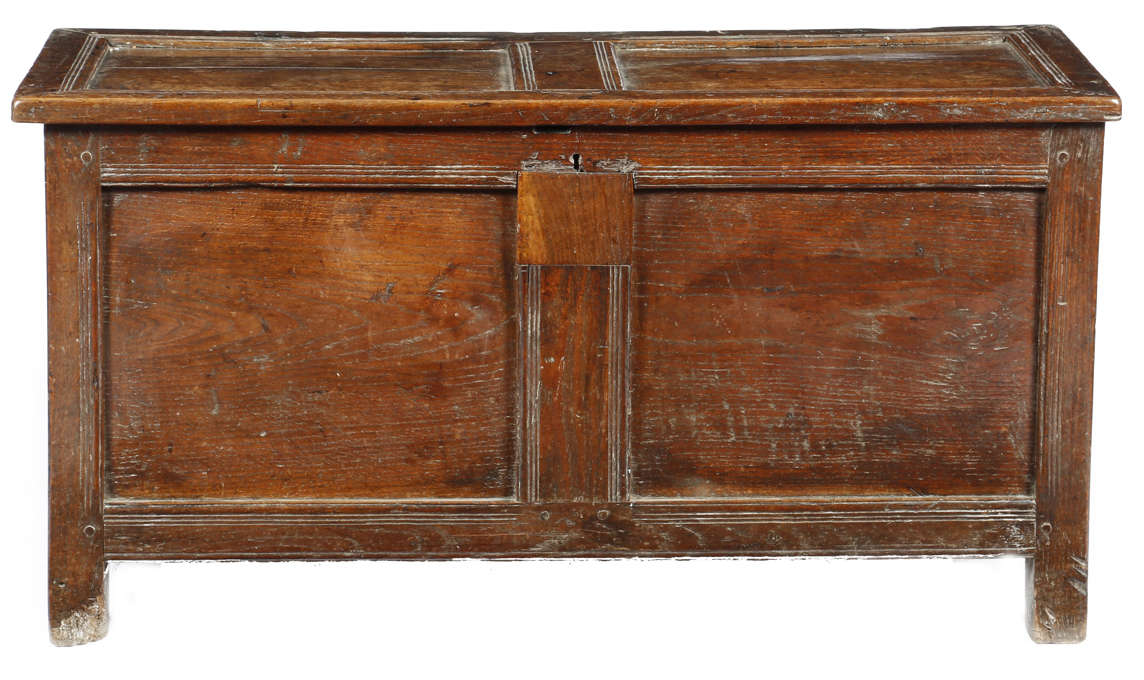 An early 18th century oak twin panelled coffer, the hinged lid enclosing an interior with a till,