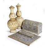 A Kashmiri lacquered papier-mache desk set by Ganemede, decorated with blue flowers on an ivory