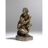 After the antique. An early 19th century Italian bronze Grand Tour model of the 'Crouching Venus',