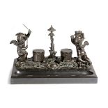 A 19th century French bronze and black marble Grand Tour inkstand, modelled with winged cherubs