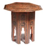 An Anglo-Indian red and black lacquer occasional table, the octagonal detachable top decorated