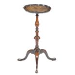 A late George II mahogany wine stand, the circular top with a pie-crust moulded edge, on a