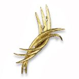 A diamond-set gold spray brooch, made from intertwining engraved gold crescents set with four