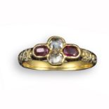 A 17th century diamond and garnet quatrefoil ring, set with two rose-cut diamonds and oval-shaped