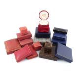 A collection of seventeen antique jewellery boxes, including a circular case by Cartier, a fitted