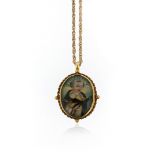 An 18th century reliquary pendant, depicting The Virgin Mary to one side and St Francis to the