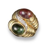 A tourmaline and diamond ring, set with a pink and green tourmaline cabochon conjoined with a