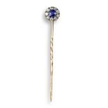 A sapphire and diamond stick pin, the circular-cut sapphire is set within a surround of diamonds