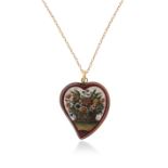 A micromosaic witches heart pendant, the tesserae depicting a giardinetto within plain gold frame,