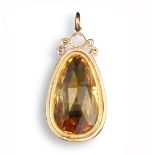 A topaz pendant, the orange briollette-shaped topaz set in yellow gold collet, 3.3cm high