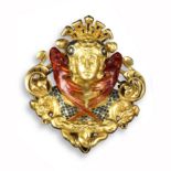 A gold revivalist brooch in the form of a stylised sphinx, wearing an elaborate head dress with