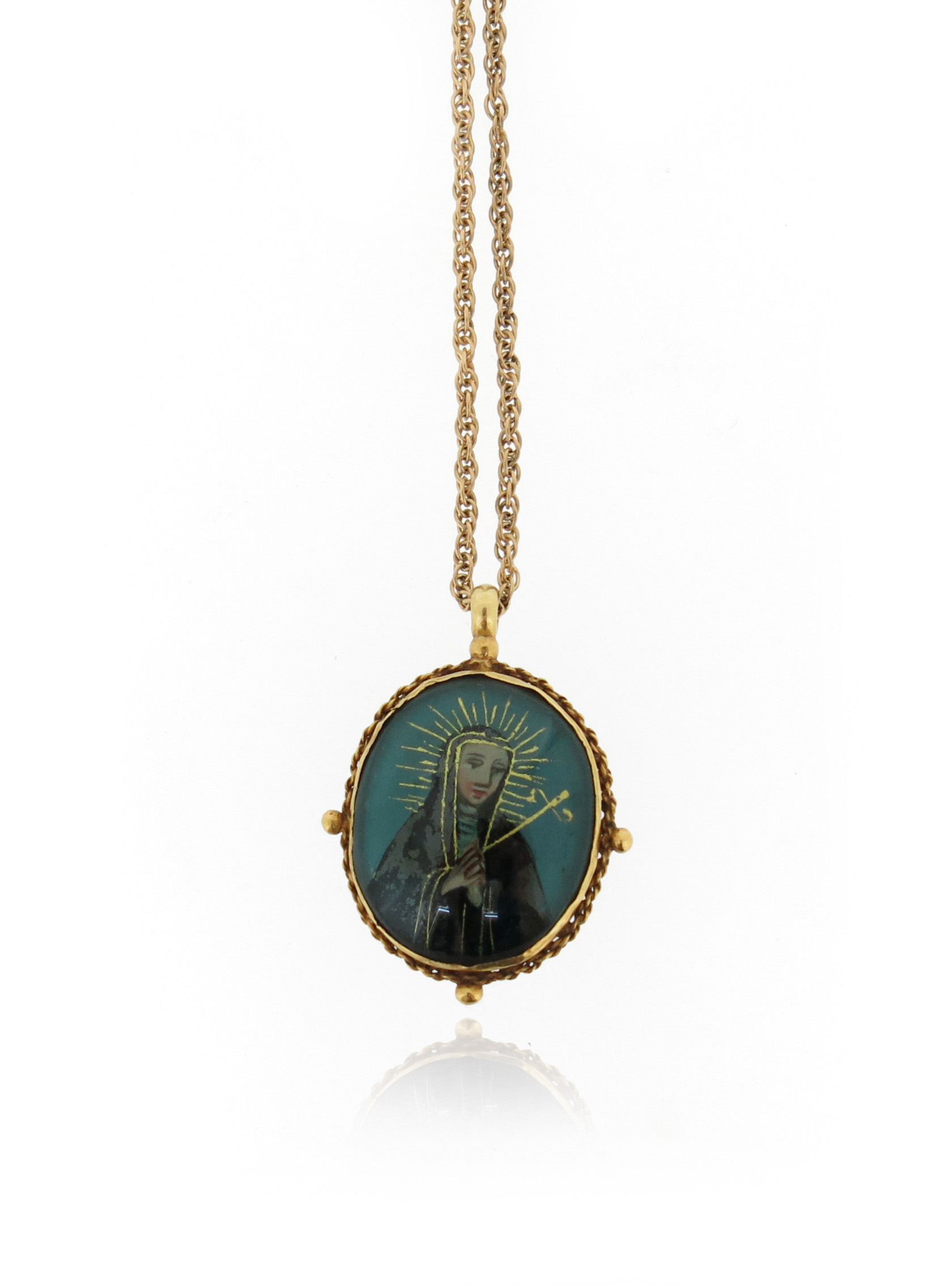 An 18th century reliquary pendant, depicting The Virgin Mary to one side and St Francis to the - Image 2 of 3