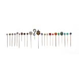 Twenty-three assorted stick pins, set with stones including a garnet, opal, ruby and turquoise From