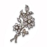 A late 19th century diamond foliate brooch, the largest flowerhead mounted 'en tremblant', pavé-