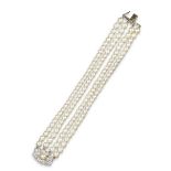 A cultured pearl and diamond bracelet, the four row bracelet terminating with an Art Deco cultured