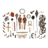 A collection of various mixed jewellery items, including a steel bodkin with diamond and gem-set two