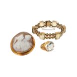 A carved shell cameo brooch in gold frame, a 9ct gold gate-link bracelet mounted with six emerald-