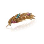 A gem-set gold wheatsheaf brooch, the stylised gold brooch set with diamonds, turquoise cabochons,