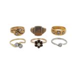 A group of six gold and gem-set rings, including a diamond two stone cross-over ring, size P, a