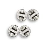 A pair of diamond cufflinks, each disc set with two French-cut diamonds within pierced circular disc