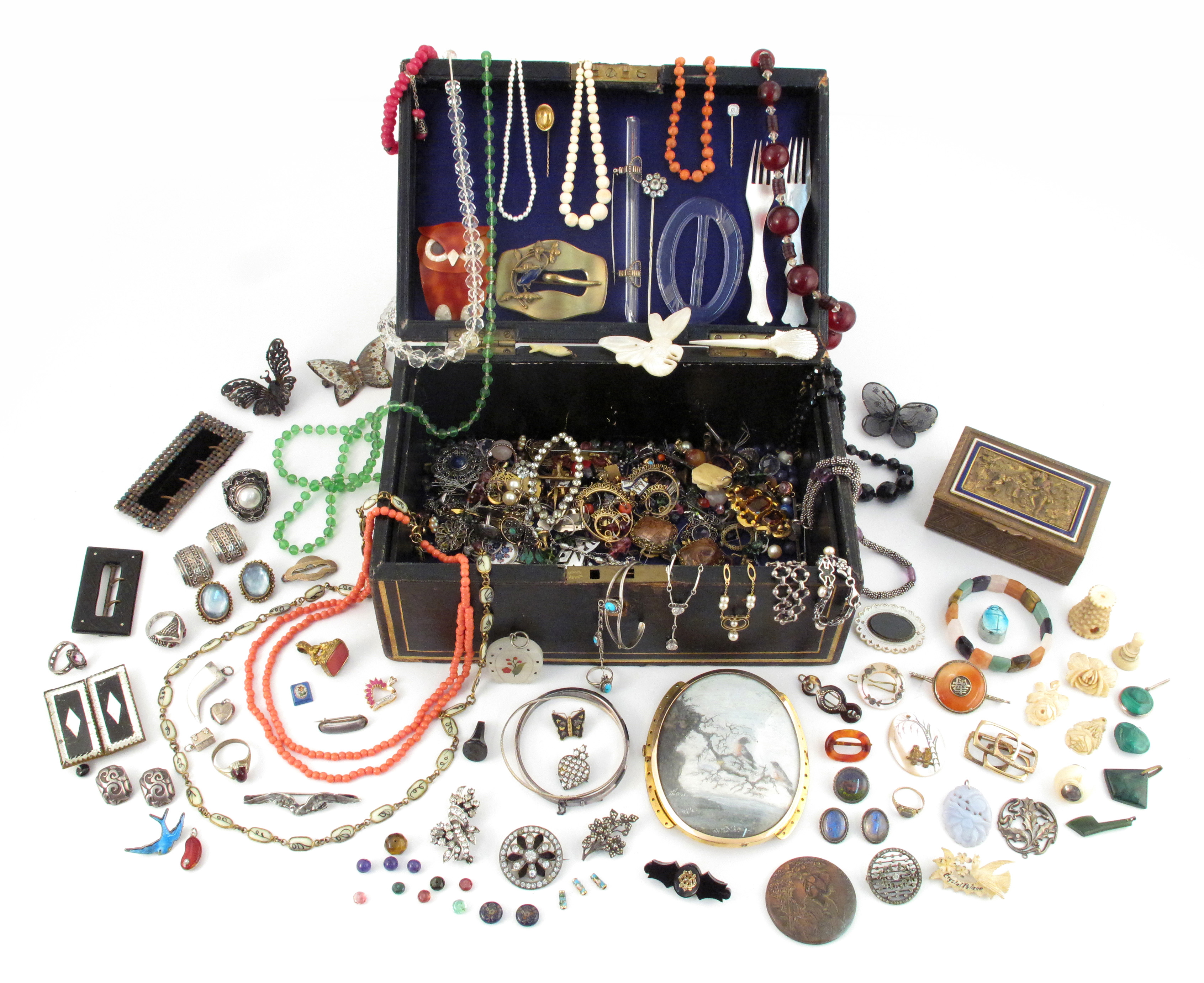 A jewellery casket containing various items of jewellery etc., including a large clasp containing an