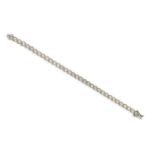 A diamond line bracelet, the circular-cut diamonds (one missing) weigh approximately 1.00cts in