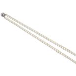 A two row cultured pearl necklace, set with a sapphire and diamond cluster clasp, the central