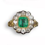 A Regency emerald and diamond cluster ring, c1830, the emerald-cut emerald is set within a