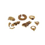 A faceted red stone-mounted gold ring in the classical manner, with case, and various gold items and