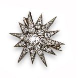 A late 19th century diamond starburst brooch, set overall with graduated old cushion-shaped diamonds