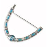 An Arts & Crafts silver and enamel bracelet by Murrle Bennett & Co, each panel decorated with blue