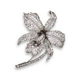 A diamond-set orchid brooch, realistically designed and pave-set with graduated circular-cut