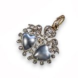 A Victorian moonstone and diamond pendant, set with two heart-shaped moonstone cabochons within a