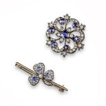 A Victorian sapphire and diamond brooch pendant, set with a central circular-cut sapphire within