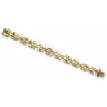 An 18ct yellow gold tank track bracelet, Birmingham hallmarks for 1975, 18cm long, 55g