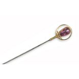 A pink tourmaline and gold hat pin by Murrle Bennett & Co., of circular design, mounted with a