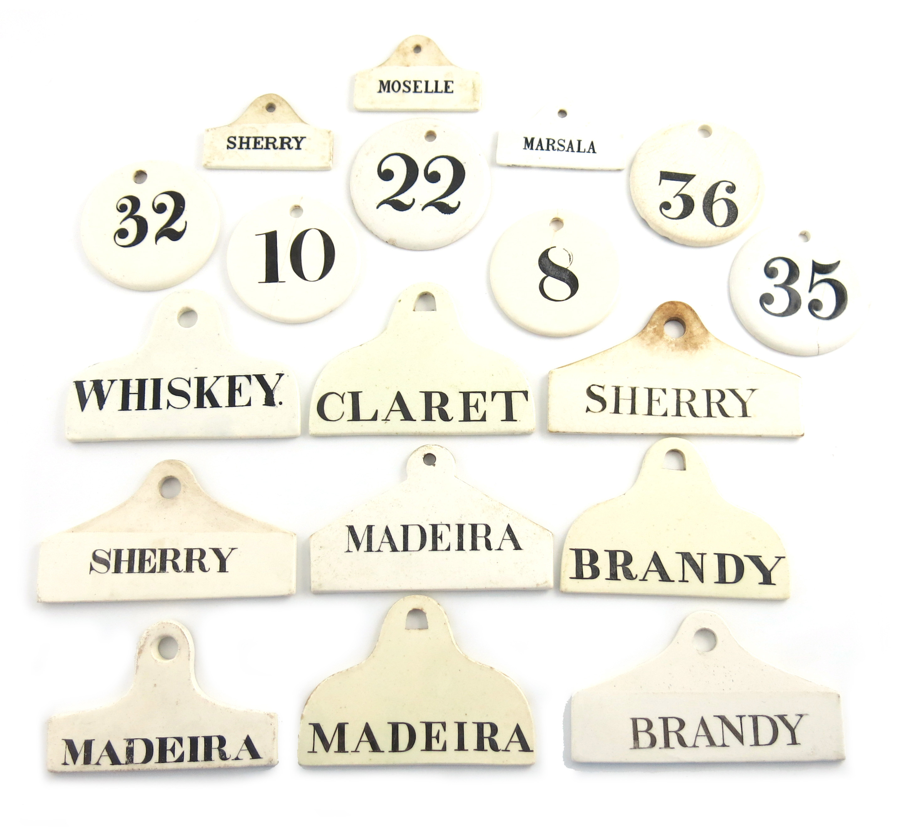 A collection of ceramic bin labels, some by Wedgwood, comprising: 'CLARET', 'SHERRY' (x2), 'MADEIRA'