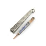 A 19th century novelty silver pencil, unmarked, modelled as an obelisk, with engraved hieroglyphs,