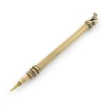 A Victorian gold pencil, unmarked, cylindrical form, engine-turned decoration, the finial set with a