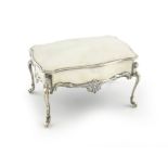 An Edwardian silver dressing table box, by William Comyns, London 1902, shaped rectangular form,