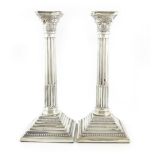 A pair of modern silver Corinthian column candlesticks, by Albert Sydenham, Birmingham 1960,