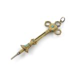 A Victorian novelty gold pencil, unmarked, modelled as a cross, mounted with turquoise cabochons,