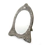 A modern silver mirror, by Keyford Frames Ltd, London 1985, arched form, embossed foliate scroll