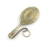 λA French novelty silver-gilt pencil and aide memoire, modelled as a hand mirror, engine-turned