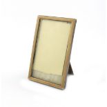 A silver and enamel photograph frame, by Albert Carter, Birmingham 1930, rectangular form, with