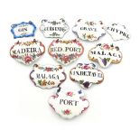 A collection of ten enamelled wine labels, English and French, various dates, some Staffordshire,