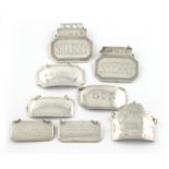 A collection of eight modern silver wine labels, various dates and makers, broad rectangular form,