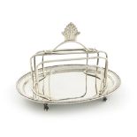 A George III toast rack, by Fogelberg and Gilbert, London 1784, oval form, scroll and bead border,