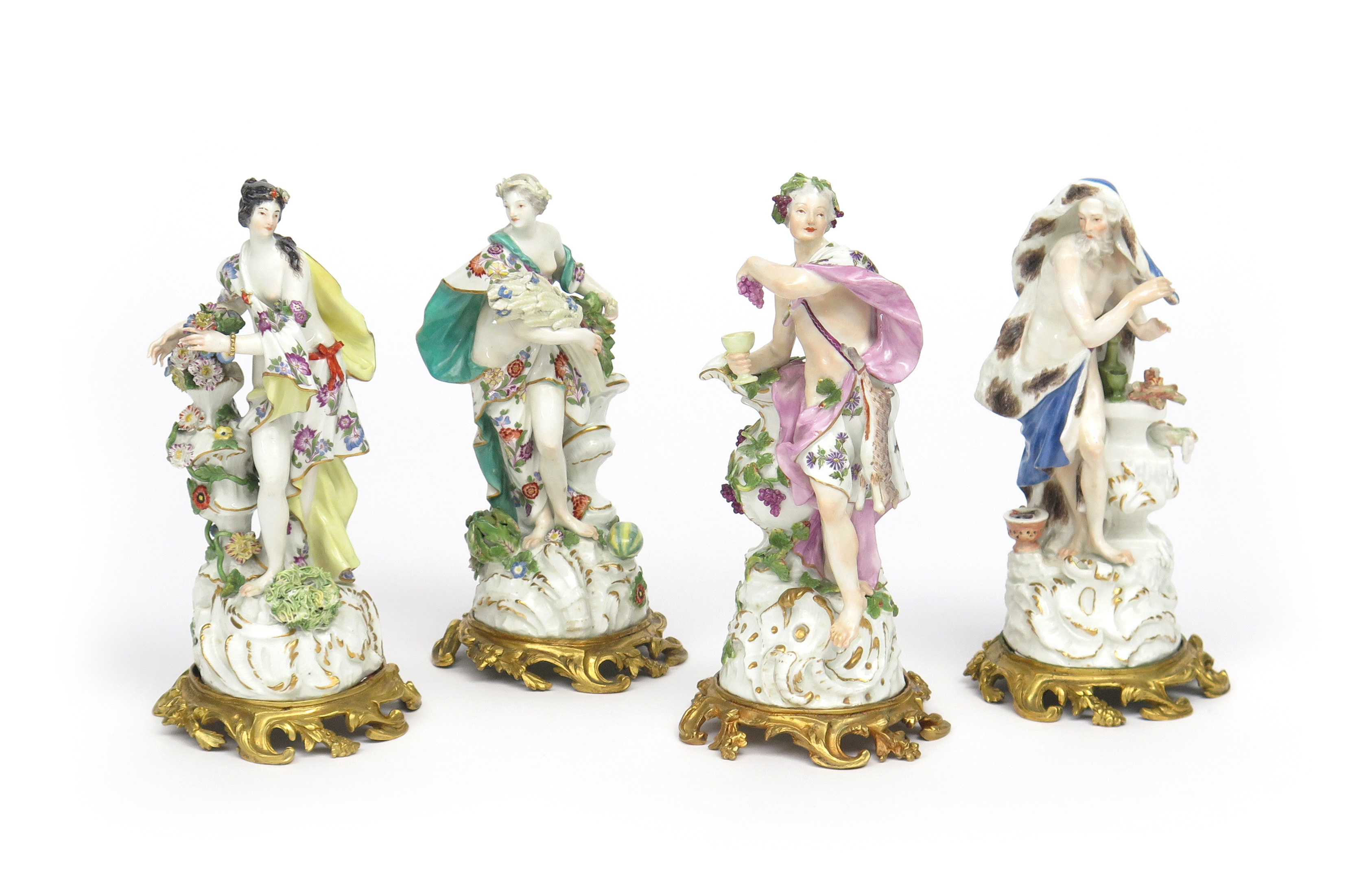 A set of ormolu-mounted Meissen figures of the Four Seasons c.1760, each modelled as a Classical