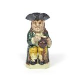 A Ralph Wood type Toby jug c.1790-95, of Mould 51 type, seated and holding a cup of ale in his right